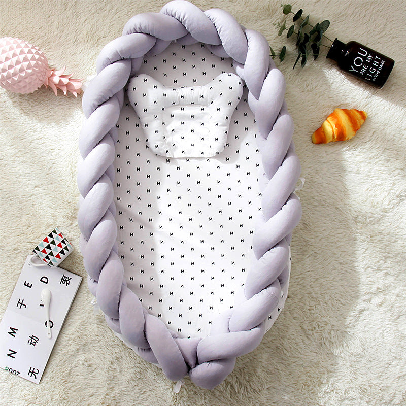 Hemei cotton woven portable baby pillow bed mid-bed bionic detachable and washable baby nest three-dimensional protective baby bed