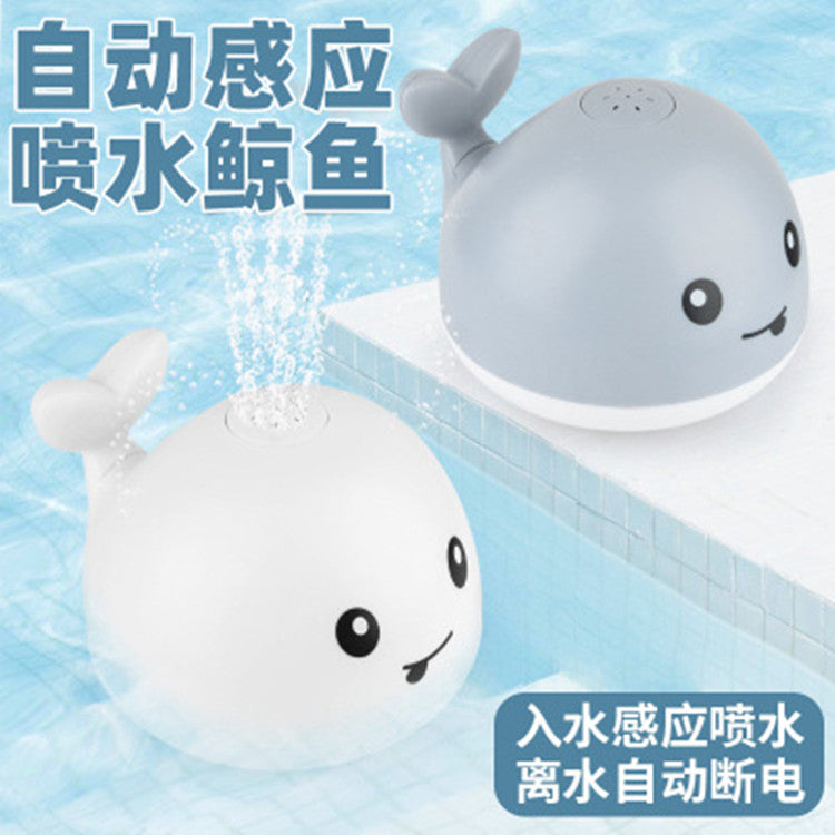 Cross-border hot sale electric little whale induction water jet light universal music stall swimming baby bath toy