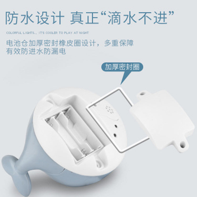 Cross-border hot sale electric little whale induction water jet light universal music stall swimming baby bath toy