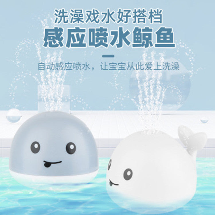 Cross-border hot sale electric little whale induction water jet light universal music stall swimming baby bath toy