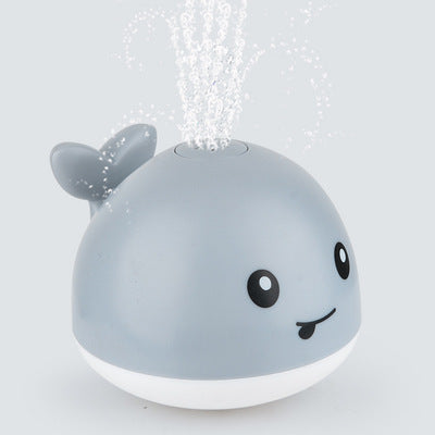 Cross-border hot sale electric little whale induction water jet light universal music stall swimming baby bath toy