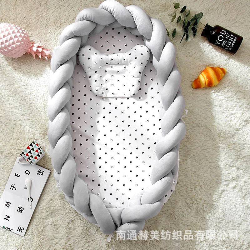 Hemei cotton woven portable baby pillow bed mid-bed bionic detachable and washable baby nest three-dimensional protective baby bed
