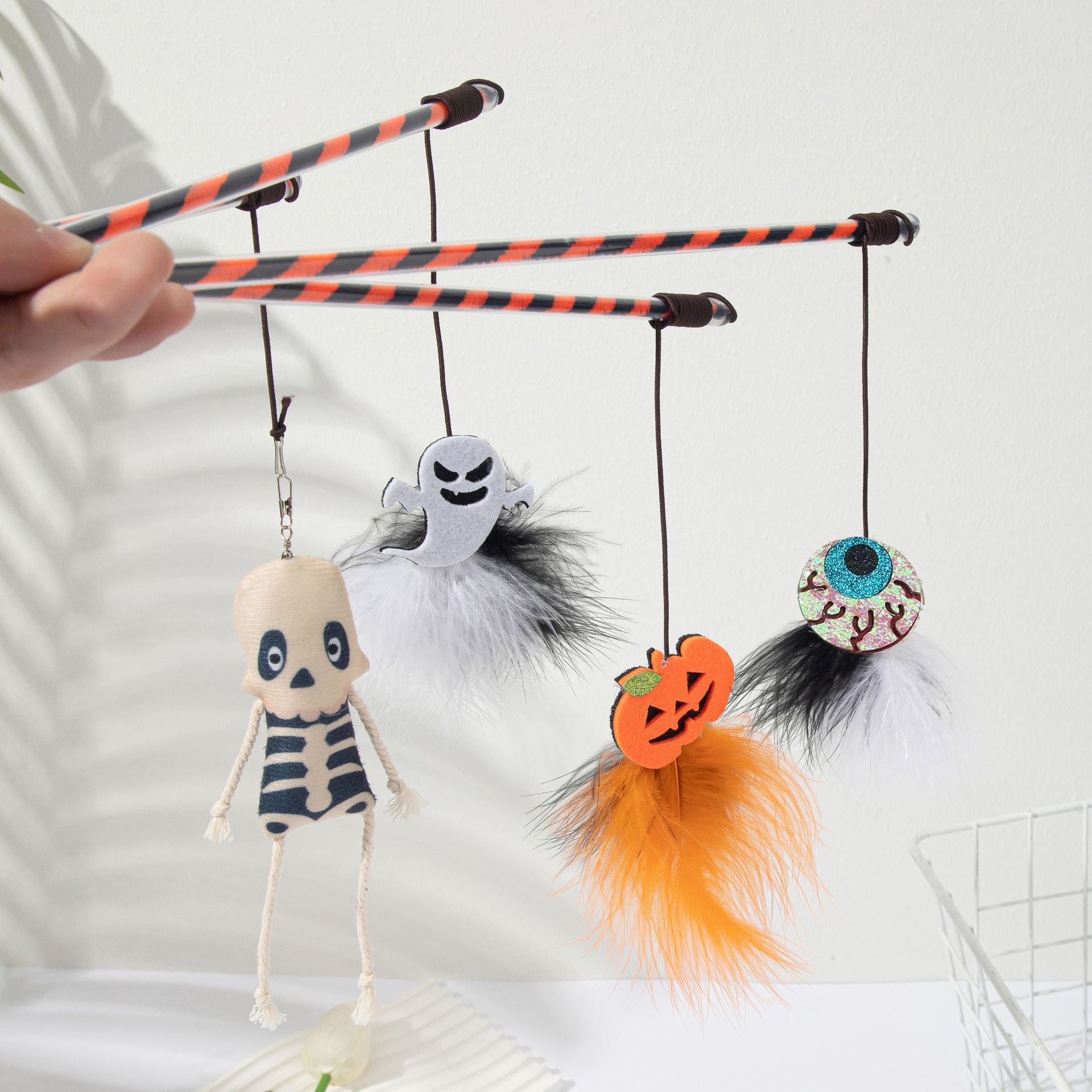 Cross-border new Halloween cat toys new cat teaser pumpkin ghost feather bell plastic cat toy manufacturer